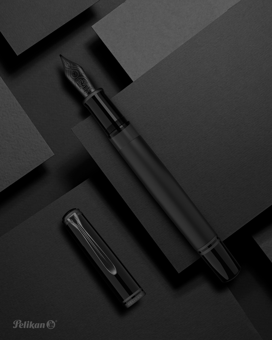 Pelikan Souverän M809 black matte fountain pen with gold accents and smooth grip section.