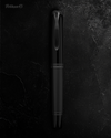 Pelikan Souverän M809 black matte fountain pen with gold accents and a silver clip, showcasing its elegant design.