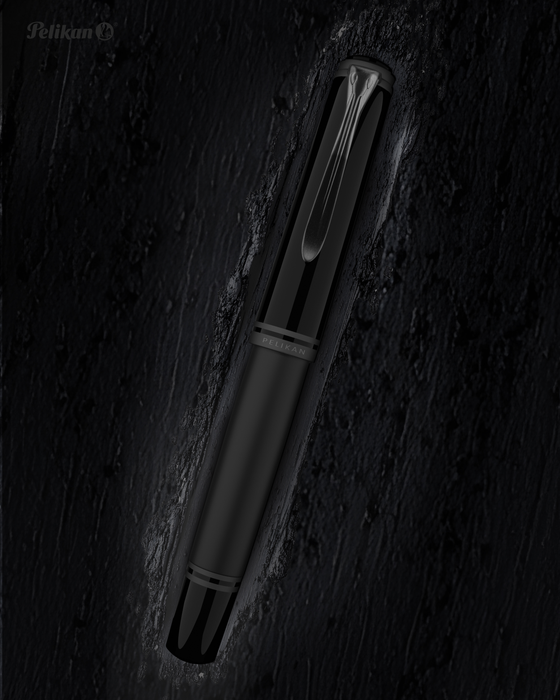 Pelikan Souverän M809 black matte fountain pen with gold accents and a smooth ink nib.