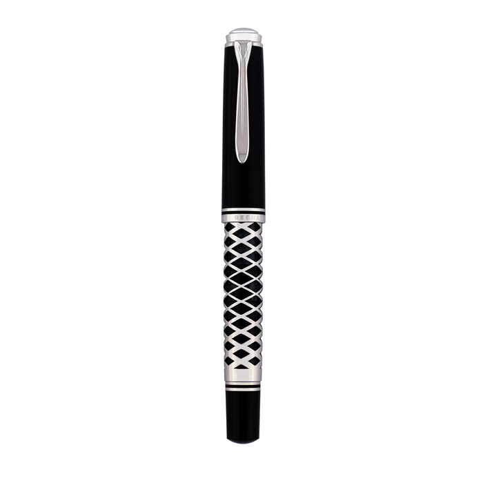Pelikan Souverän M805 fountain pen with metal sleeve, black body and gold accents, showcasing its luxurious design and fine nib.