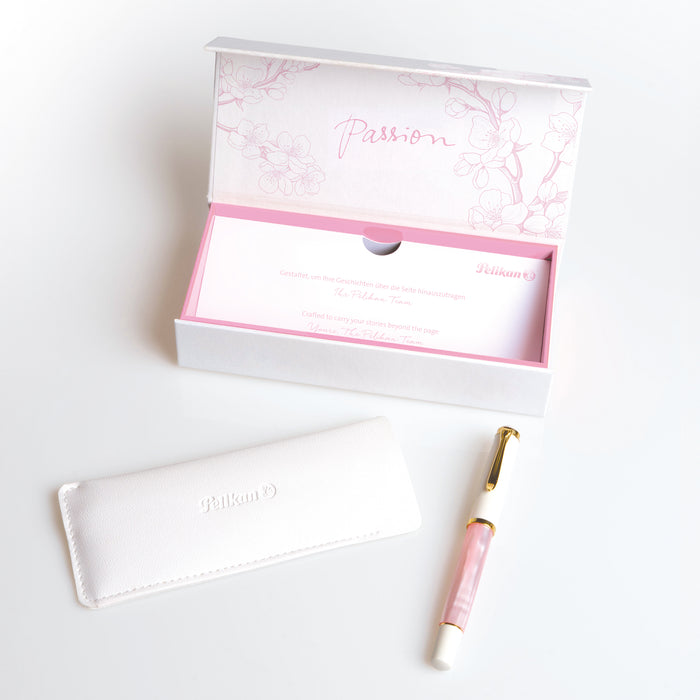 Pelikan M200 Cherry Blossom fountain pen with pink lacquer finish and gold accents, displayed on a white background.