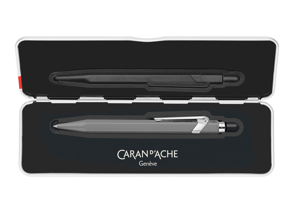 Caran D'Ache Roller Pen 849™ in grey with slim design, featuring smooth rollerball tip and sleek body for writing precision.