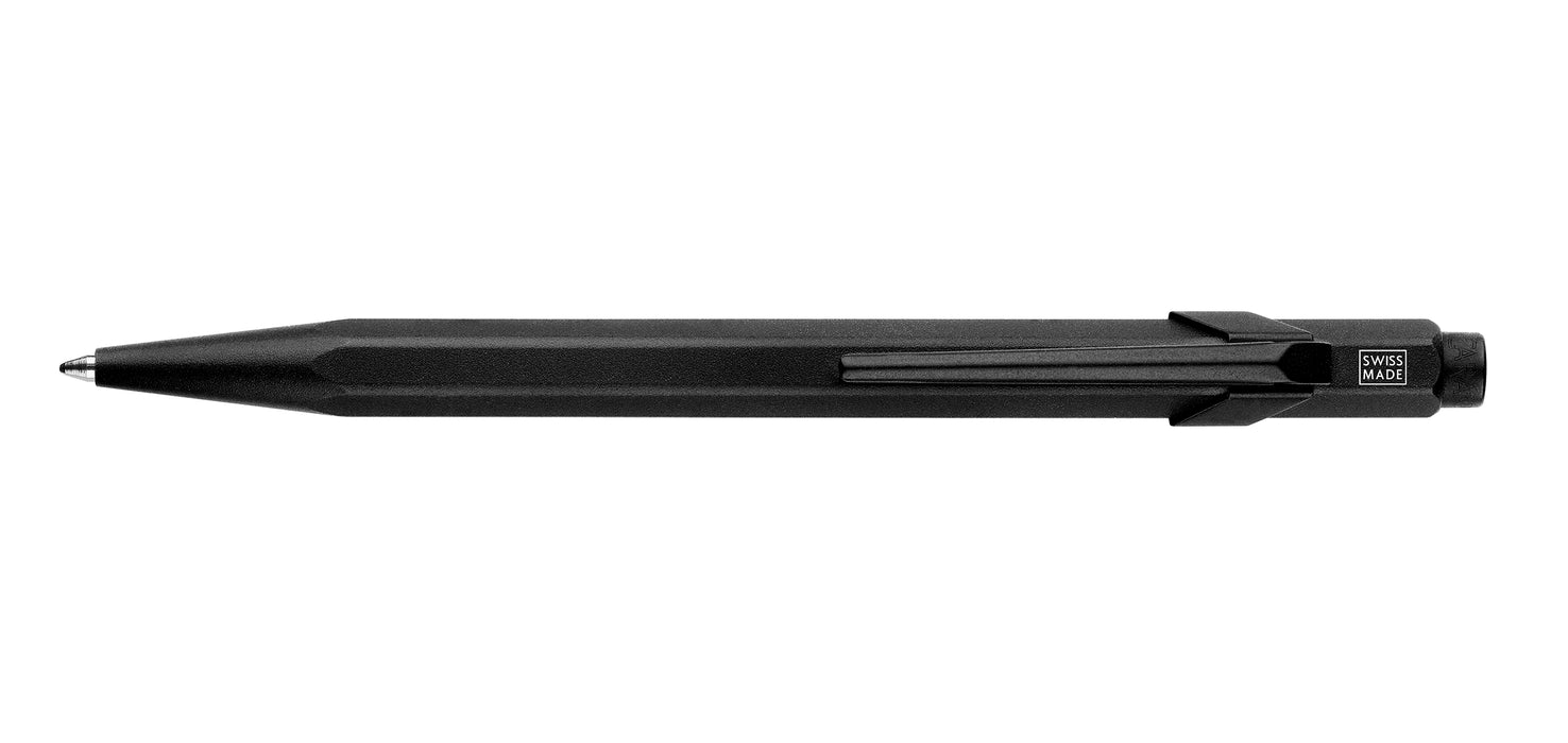 Caran D'Ache XL 849™ black ballpoint pen with sleek design and smooth writing tip, shown with black body and silver accents.