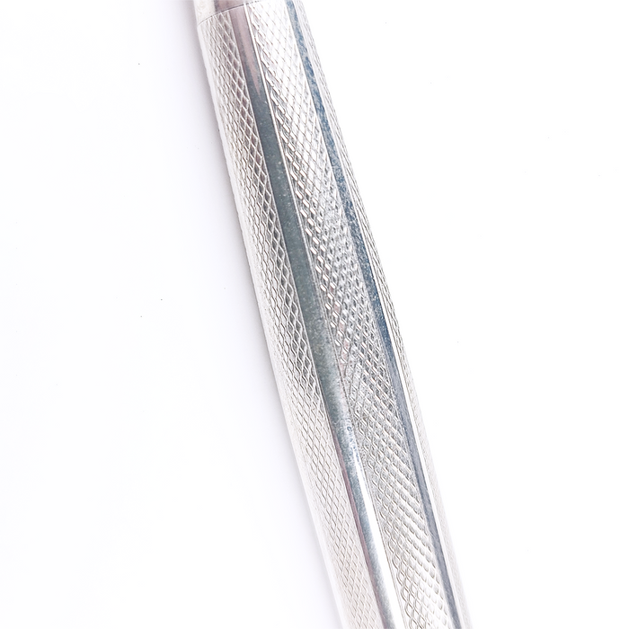 Close-up of a textured sliver pen on a light gray background