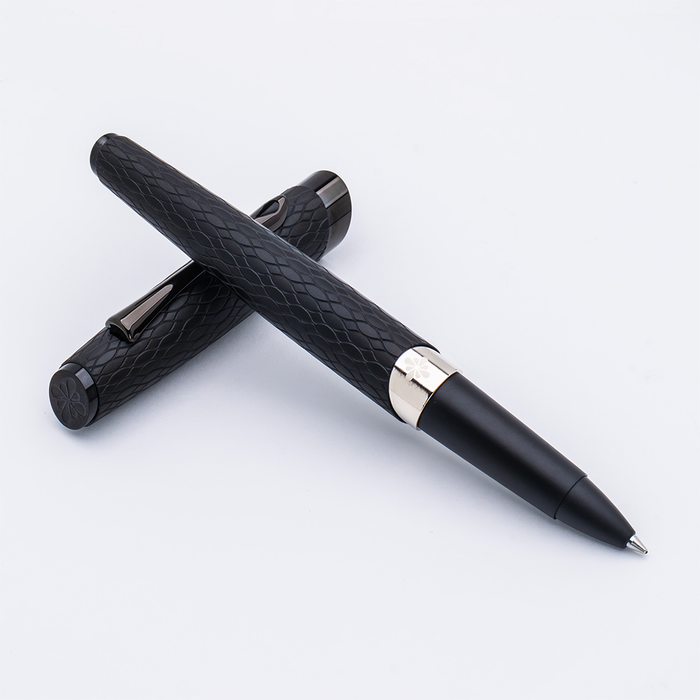 Diplomat Cobra matte black rollerball pen with sleek design and silver accents, showcasing a modern writing instrument.