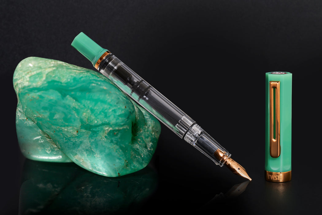 Twsbi Eco fountain pen in Jade Jelly with bronze trim and transparent demonstrator barrel