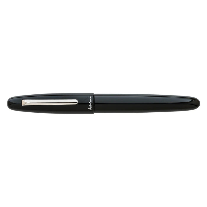 Esterbrook Estie fountain pen with silver fittings, black body, and closed cap, showcasing elegant craftsmanship.