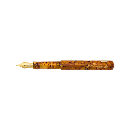 Esterbrook Niblet fountain pen with honey-colored resin barrel and gold-tone nib, showcasing elegant vintage design.