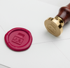 Papier Plume wax seal with ink bottle design for sealing letters and envelopes, featuring intricate wax craftsmanship.
