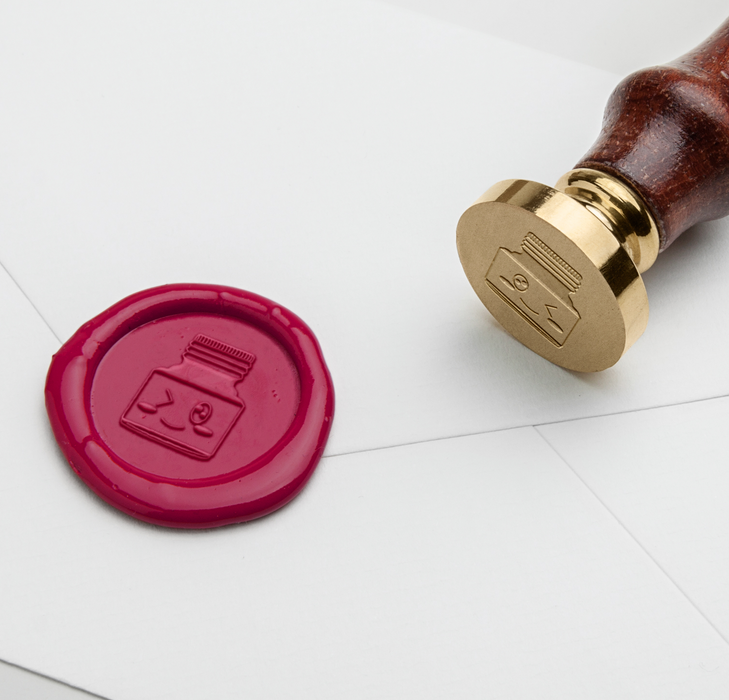 Papier Plume wax seal with ink bottle design for sealing letters and envelopes, featuring intricate wax craftsmanship.
