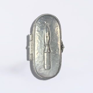 Le Potier D'Étain pewter nib box showing a collection of fountain pen nibs in a sleek, vintage-style storage container.