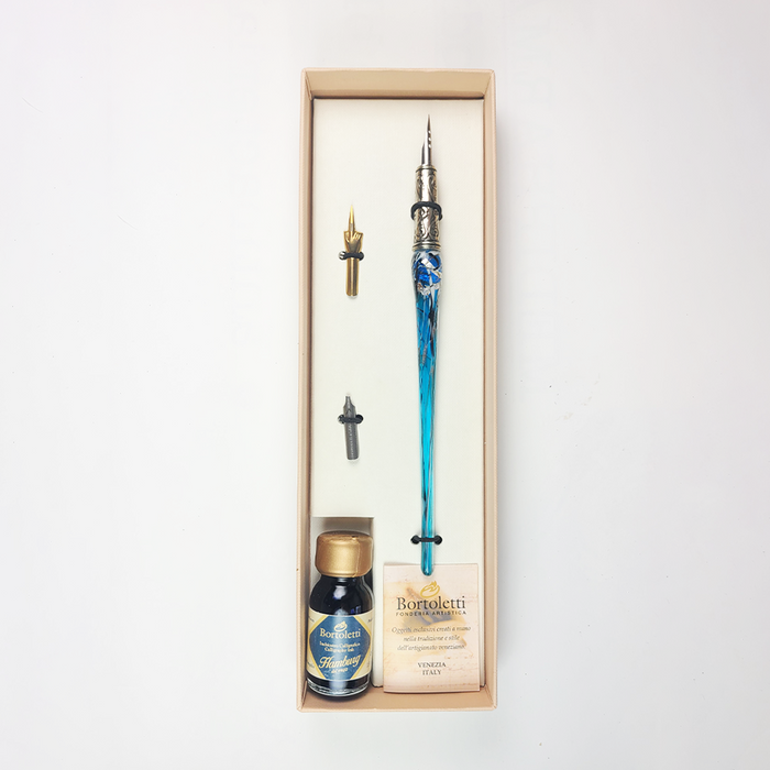 Bortoletti glass dipping pen set with 20 aquamarine-colored pens, showcasing elegant handcrafted glass writing instruments.