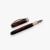 Visconti Comedia fountain pen with a sleek ink-colored barrel and gold accents, displayed on a white background.