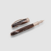 Visconti Comedia fountain pen with a sleek, dark-colored body and polished silver accents.