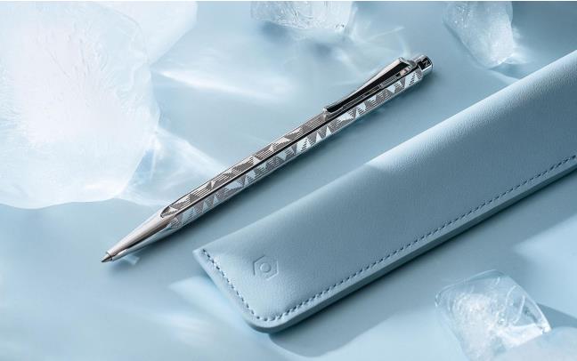 Caran D'Ache Ecridor Alpine Frost and Polar Blue ballpoint pen set with leather case, featuring sleek metal and elegant design details.