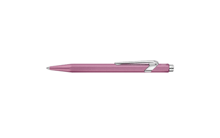 Caran D'Ache Ballpoint Pen 849 with rose-colored barrel and silver accents, close-up showing detailed design and branding.
