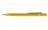 Gold Caran D'Ache Ballpoint Pen 849 with sleek design, displayed with its protective case.