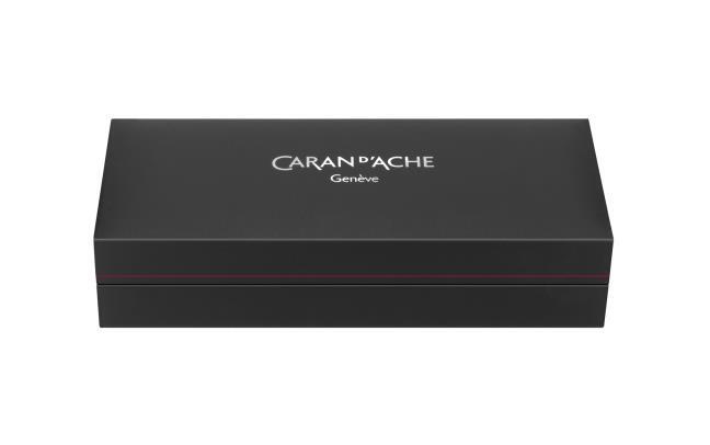 Caran D'Ache Gilded Ecridor Chevron rollerball pen with gold accents and a sleek design, close-up of the detailed barrel.